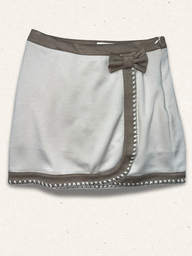 Gray skirt with a bow and stud details on a white background