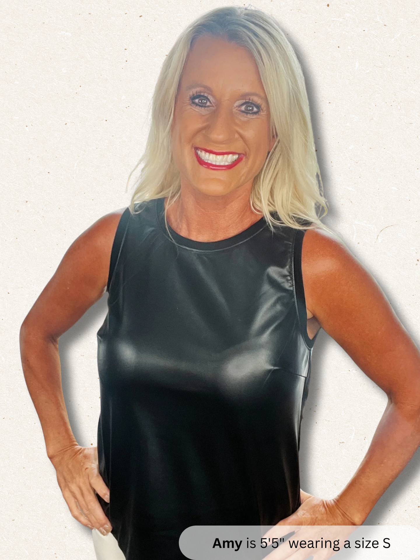 Woman wearing a black sleeveless top on a white background