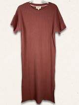 red dress with background that is textured and speckled white