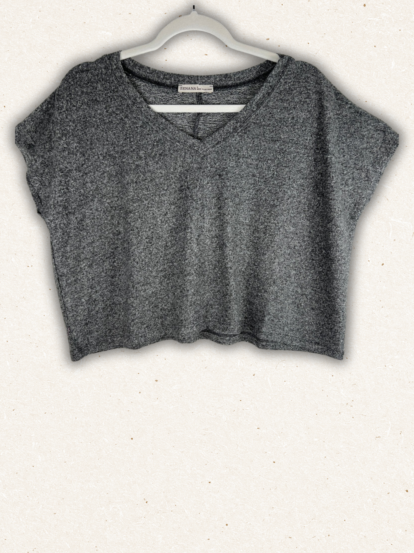 /Black/ Gray crop top on a hanger against a white background