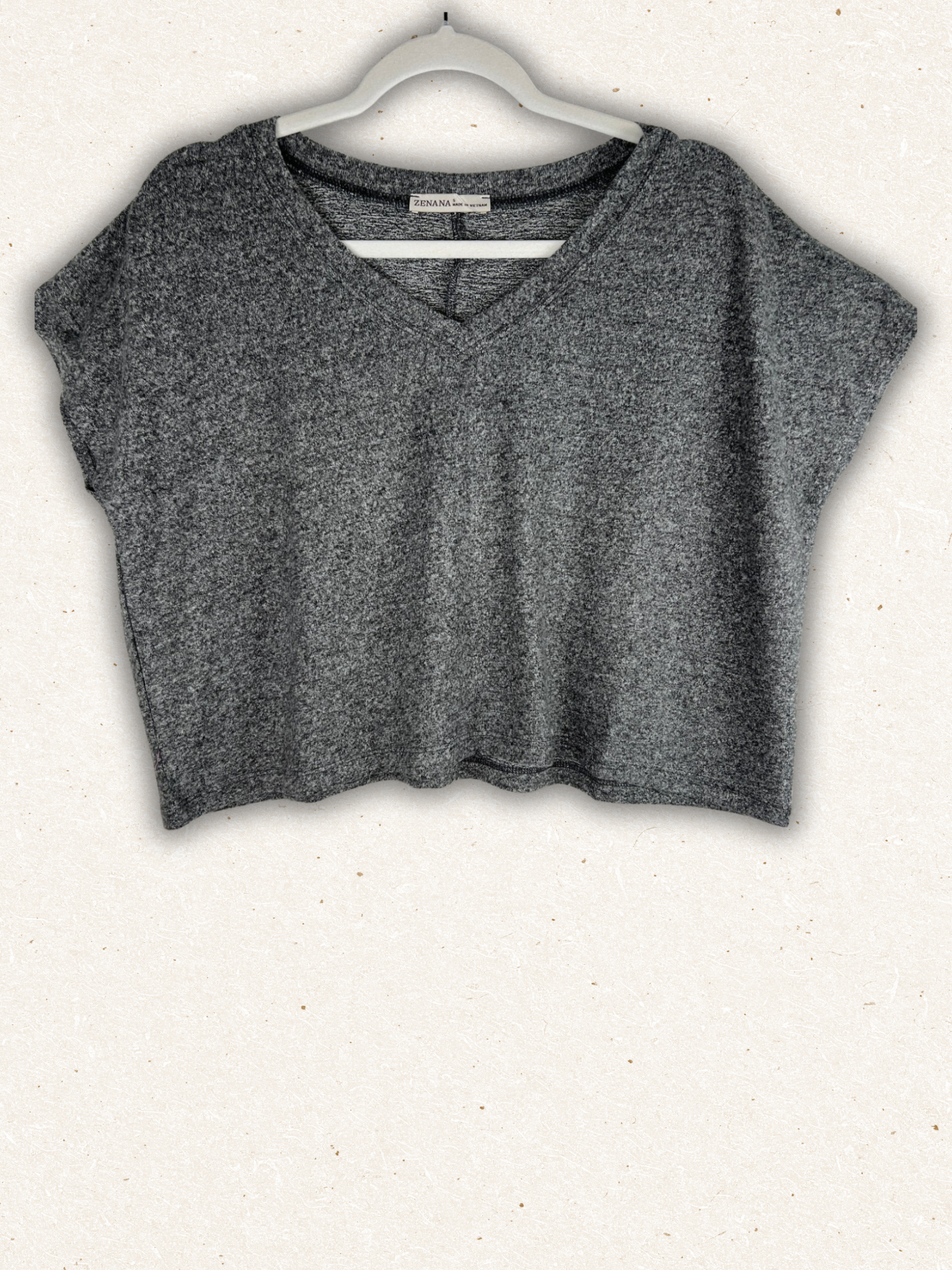 /Black/ Gray crop top on a hanger against a white background