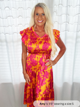 floral dress with woman standing in front of white background