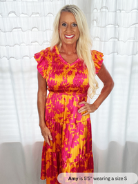 floral dress with woman standing in front of white background