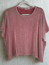 /Red/ red and white striped shirt with light beige background on a hanger