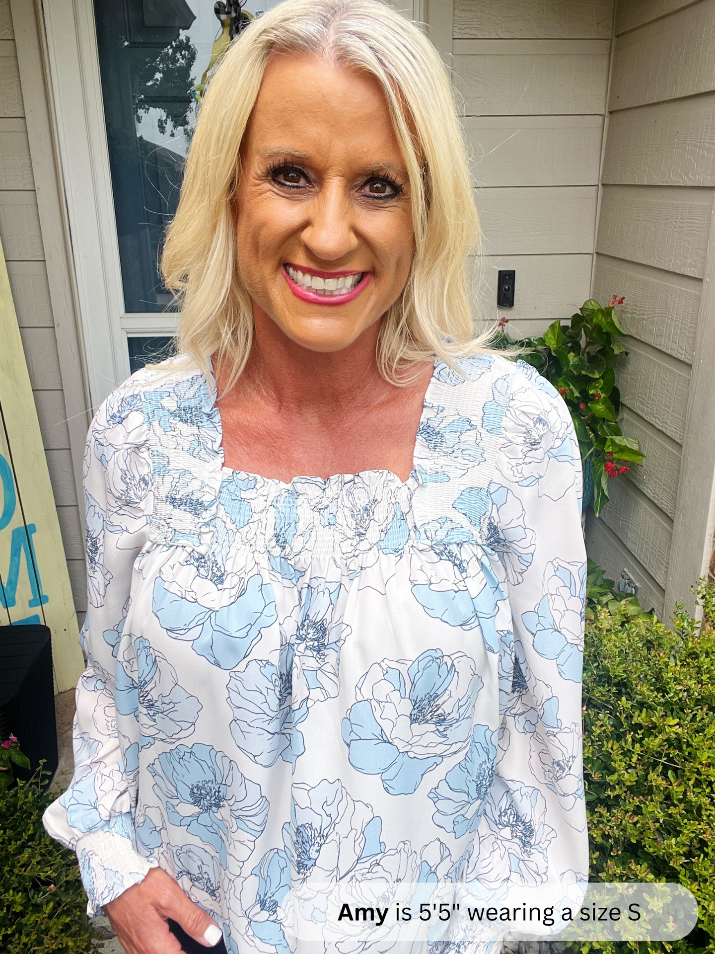 Woman wearing a floral blouse standing outdoors with text overlay about her height and size.