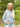 Woman wearing a gray sweater in a forest setting