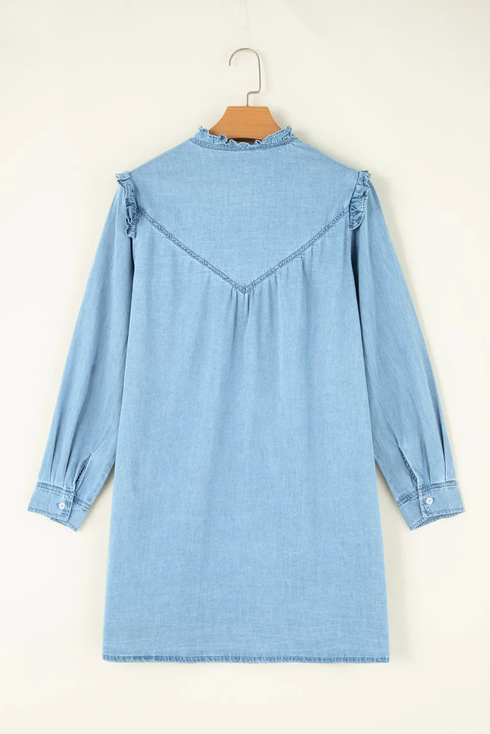 light denim dress in beige background