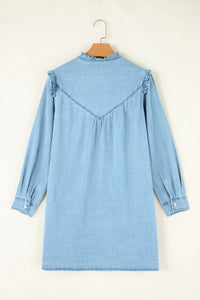 light denim dress in beige background