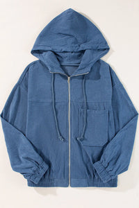 Blue hoodie with a zipper on a white background