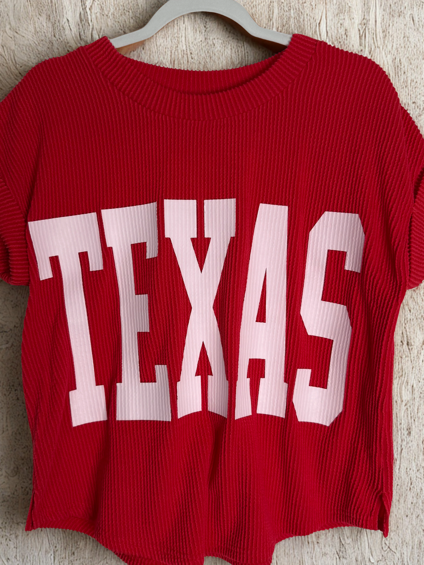 /Red/ red shirt on hanger with beige background