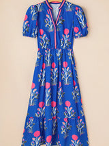 Blue floral dress on a beige background
