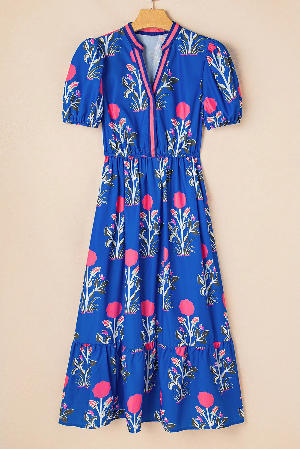 Blue floral dress on a beige background