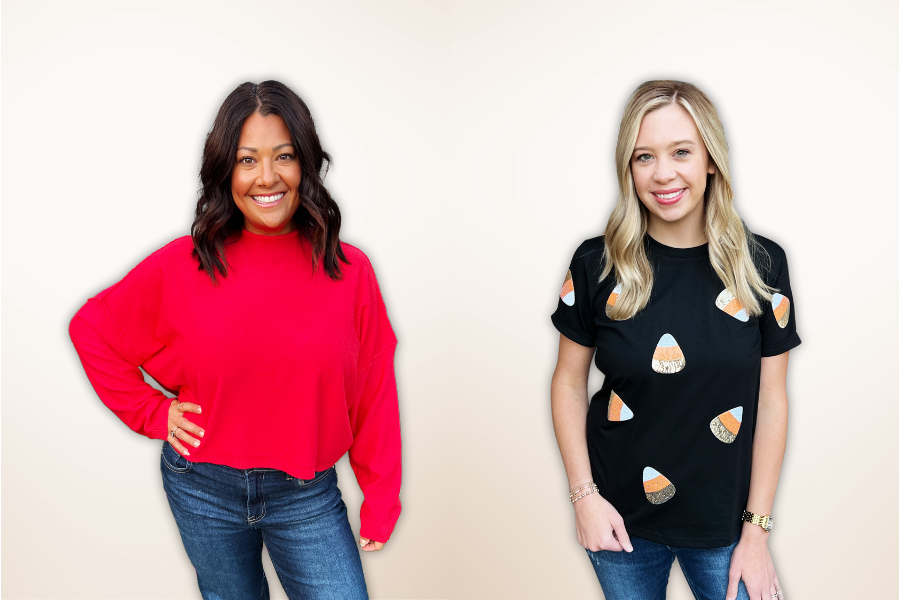 Two women wearing red and black shirts with candy corn designs on a beige background